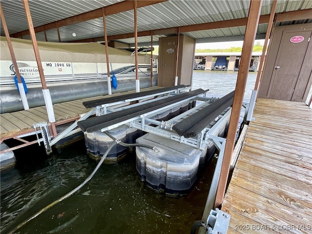 405 Barba Le Ln Unit 3B, Lake Ozark, MO 65049 - view of dock featuring boat lift and a water view