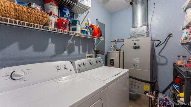 298 Storm Cove Dr, Linn Creek, MO 65052 - washroom featuring water heater, separate washer and dryer, a textured wall, and laundry area