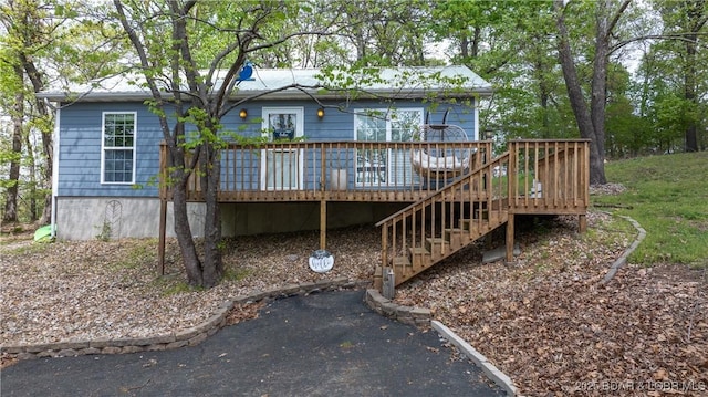 298 Storm Cove Dr, Linn Creek, MO 65052 - back of property featuring a wooden deck and stairs