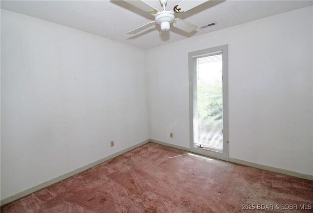 1483 Bluff Dr, Osage Beach, MO 65065 - carpeted spare room with baseboards, ceiling fan, and visible vents