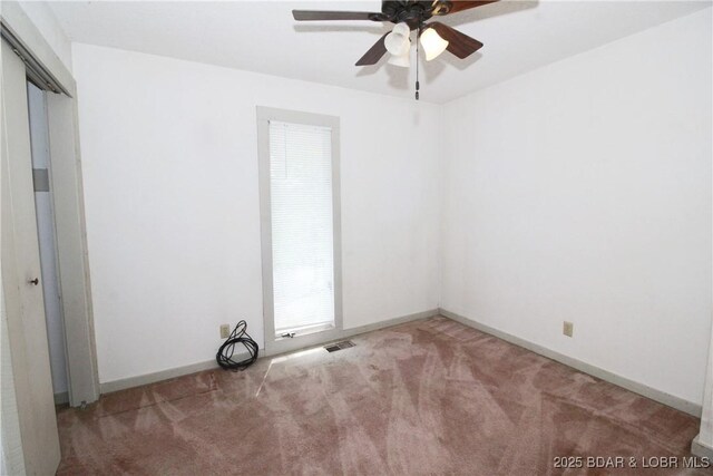 1483 Bluff Dr, Osage Beach, MO 65065 - unfurnished room featuring visible vents, carpet, ceiling fan, and baseboards