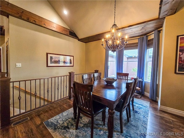 dining area featuring a notable chandelier, baseboards, wood finished floors, lofted ceiling, and visible vents