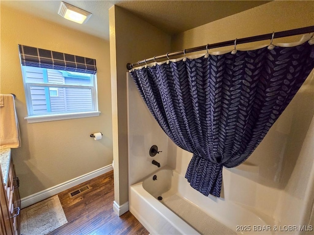212 Weiskopf Way, Camdenton, MO 65020 - full bath with wood finished floors, shower / bath combo with shower curtain, and vanity