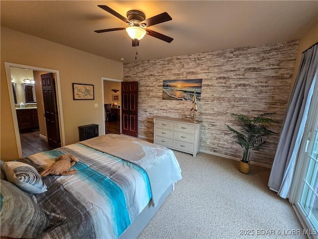 carpeted bedroom with a ceiling fan and connected bathroom
