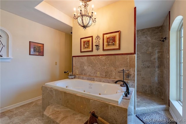 106 Bayliner Dr, Sunrise Beach, MO 65079 - full bathroom with a tub with jets, a chandelier, and a tile shower