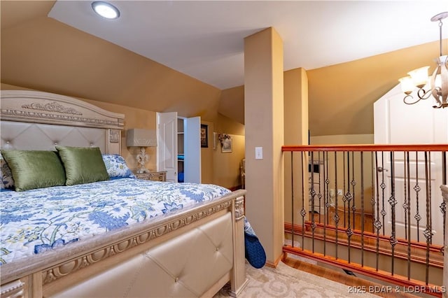 106 Bayliner Dr, Sunrise Beach, MO 65079 - bedroom featuring vaulted ceiling and a chandelier