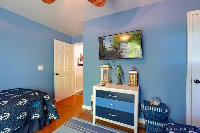 106 Bayliner Dr, Sunrise Beach, MO 65079 - bedroom featuring wood finished floors and baseboards