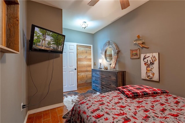 106 Bayliner Dr, Sunrise Beach, MO 65079 - bedroom with ceiling fan, baseboards, and wood finished floors