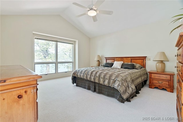 carpeted bedroom featuring ceiling fan and vaulted ceiling