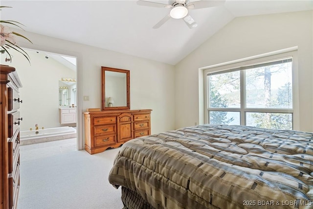 bedroom featuring connected bathroom, a ceiling fan, light colored carpet, and lofted ceiling