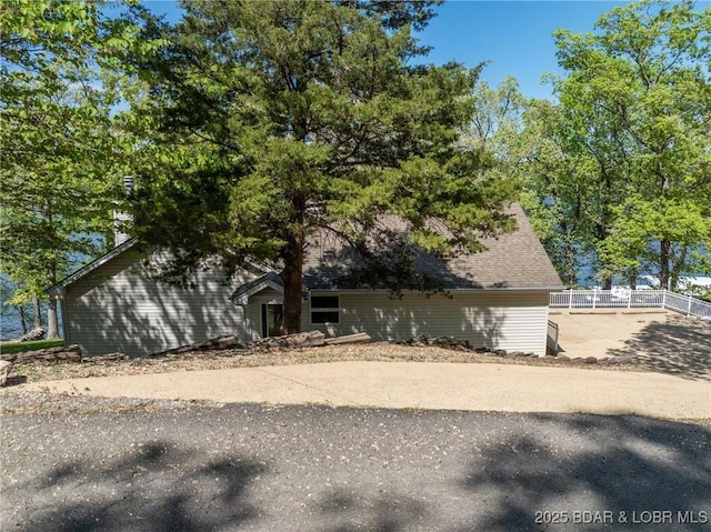 view of side of property with fence