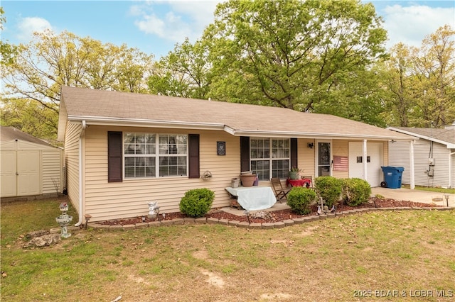 1497 Cherokee Rd W, Lake Ozark, MO 65049 - ranch-style home featuring a porch, a shed, a front yard, and a garage