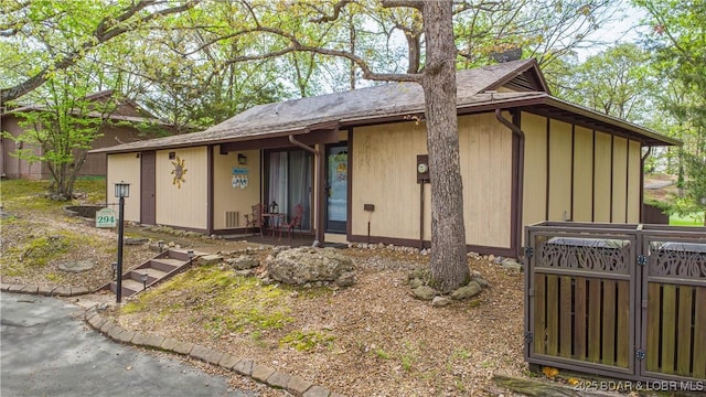 294 Moongate Dr, Osage Beach, MO 65065 - view of front of property with fence and a gate