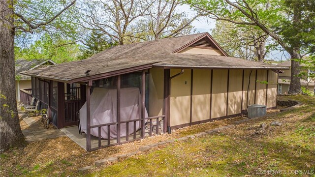 294 Moongate Dr, Osage Beach, MO 65065 - view of outbuilding with a sunroom and cooling unit