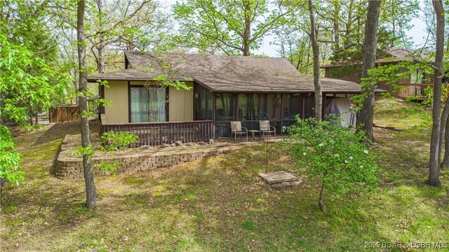 294 Moongate Dr, Osage Beach, MO 65065 - rear view of house featuring a sunroom