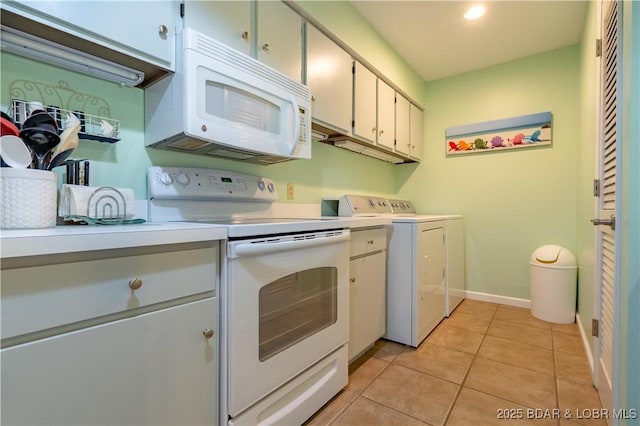 294 Moongate Dr, Osage Beach, MO 65065 - kitchen featuring light countertops, light tile patterned floors, baseboards, white appliances, and washer and clothes dryer