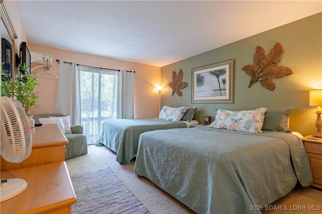 294 Moongate Dr, Osage Beach, MO 65065 - bedroom featuring access to outside and light carpet