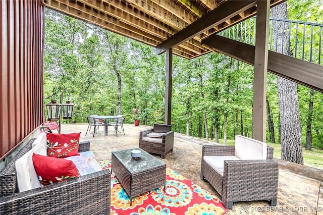 view of patio / terrace with outdoor dining area and an outdoor hangout area