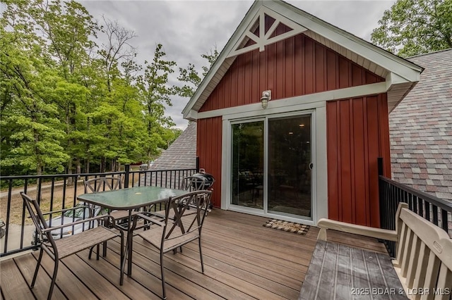 wooden deck with outdoor dining space