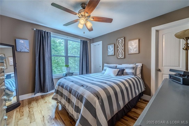 bedroom with ceiling fan and light wood finished floors