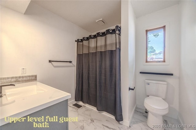 full bath featuring vanity, toilet, curtained shower, and marble finish floor