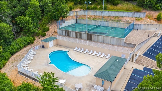 72 Emerald Bay Dr Unit 2D, Lake Ozark, MO 65049 - pool with fence, a patio, and a tennis court