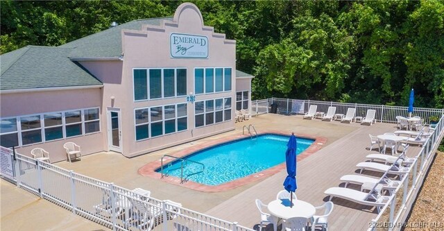 72 Emerald Bay Dr Unit 2D, Lake Ozark, MO 65049 - pool with a patio and fence