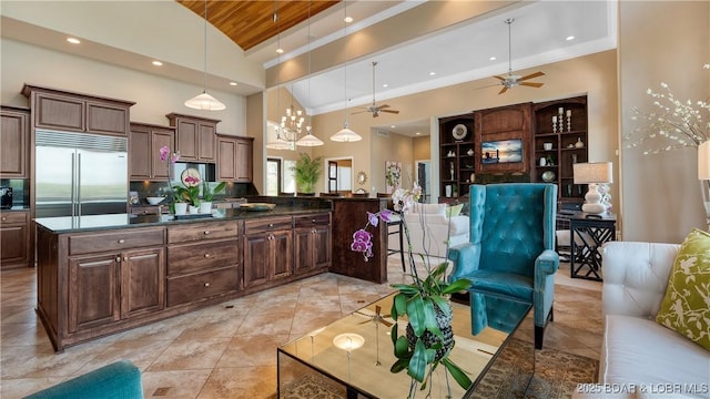 559 Forestridge Ln, Sunrise Beach, MO 65079 - kitchen featuring stainless steel built in refrigerator, wooden ceiling, dark countertops, backsplash, and vaulted ceiling