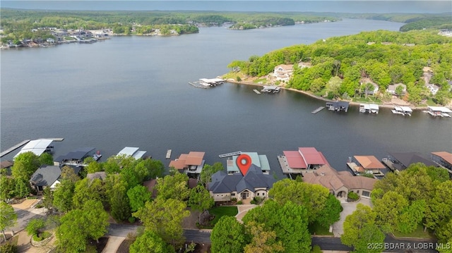 559 Forestridge Ln, Sunrise Beach, MO 65079 - aerial perspective of suburban area featuring a large body of water