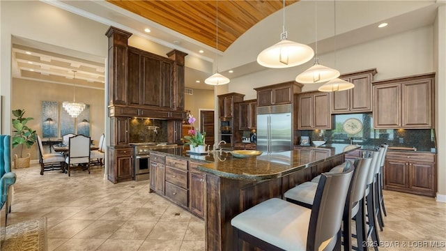 559 Forestridge Ln, Sunrise Beach, MO 65079 - kitchen with built in appliances, lofted ceiling, wooden ceiling, recessed lighting, and a breakfast bar area
