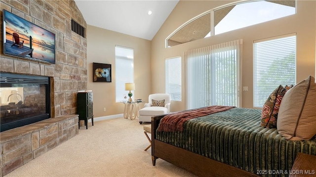 559 Forestridge Ln, Sunrise Beach, MO 65079 - carpeted bedroom with a fireplace, vaulted ceiling, baseboards, and access to exterior