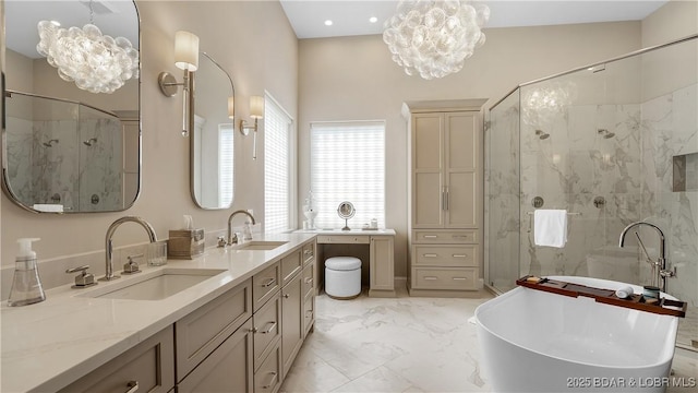 559 Forestridge Ln, Sunrise Beach, MO 65079 - full bath with a chandelier, a marble finish shower, a freestanding tub, and recessed lighting