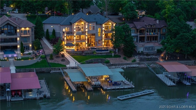 559 Forestridge Ln, Sunrise Beach, MO 65079 - rear view of house featuring a balcony, a water view, and boat lift