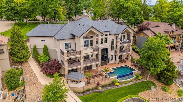 559 Forestridge Ln, Sunrise Beach, MO 65079 - aerial view of property and surrounding area featuring a pool area