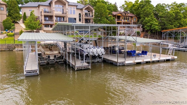 559 Forestridge Ln, Sunrise Beach, MO 65079 - dock with boat lift and a water view