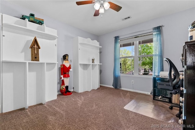 interior space with visible vents, baseboards, and ceiling fan