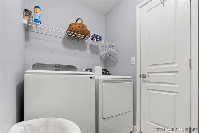 laundry area featuring independent washer and dryer and laundry area