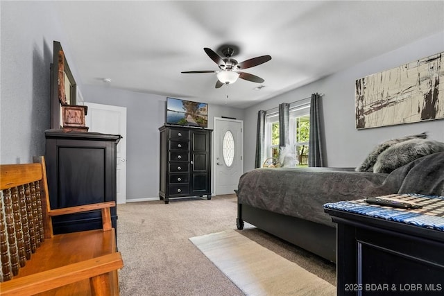 carpeted bedroom with ceiling fan and visible vents