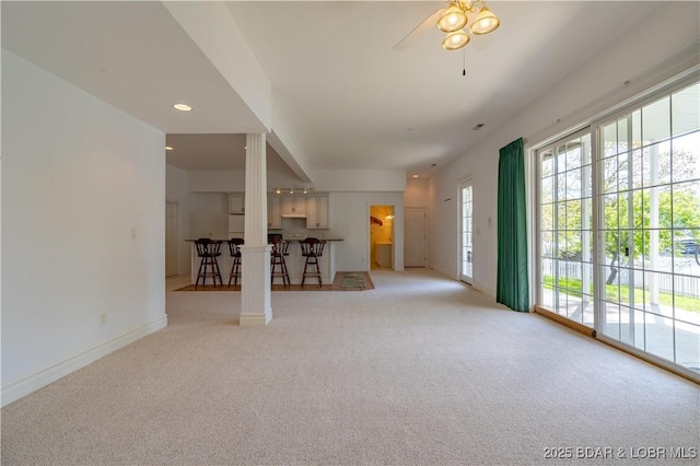 188 Bur Oaks Rd, Camdenton, MO 65020 - unfurnished living room with light colored carpet, a ceiling fan, and recessed lighting