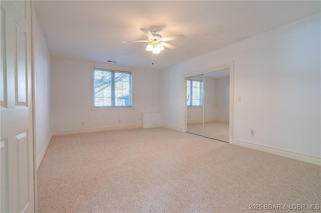 188 Bur Oaks Rd, Camdenton, MO 65020 - unfurnished bedroom with carpet floors, multiple windows, and a ceiling fan