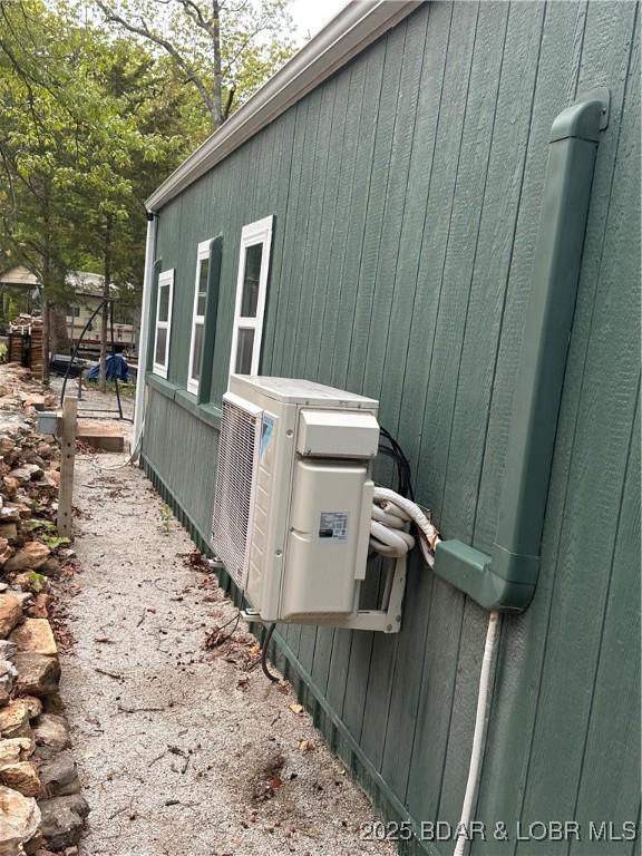 view of side of property featuring ac unit