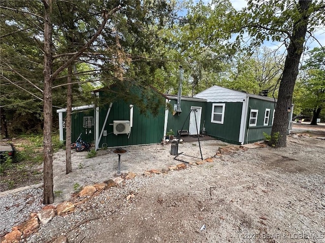 view of front of home with ac unit