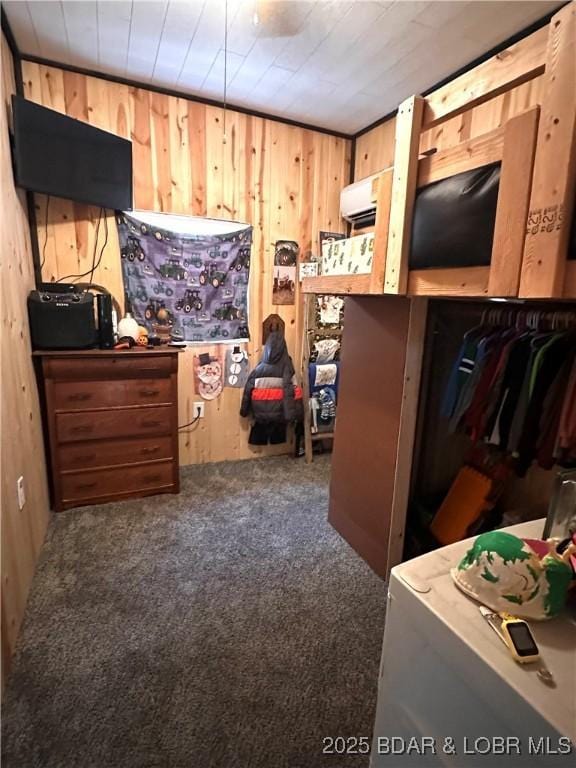 carpeted bedroom with wooden walls