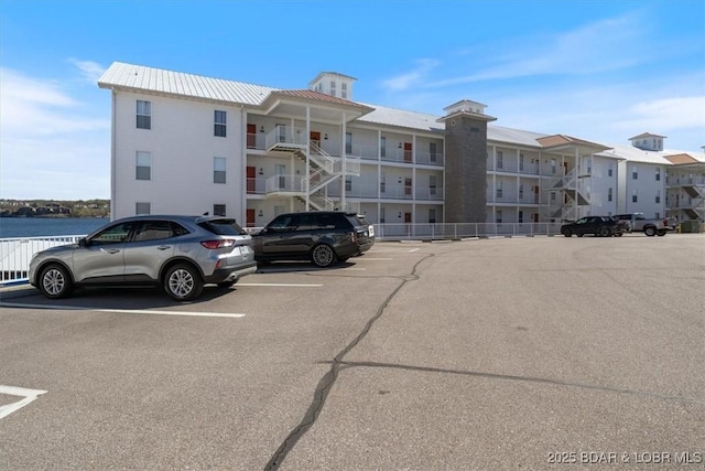 62 Knox Rd Unit 503, Rocky Mount, MO 65072 - view of building exterior featuring uncovered parking