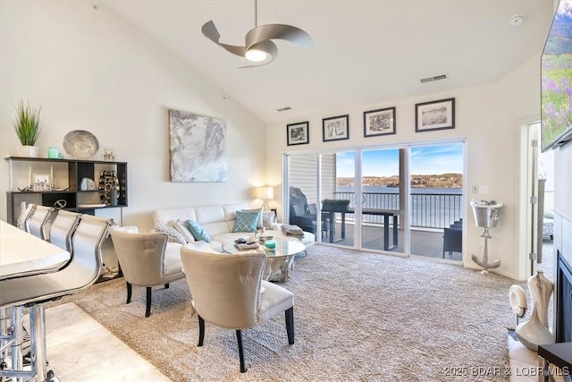 62 Knox Rd Unit 503, Rocky Mount, MO 65072 - living area with carpet flooring, high vaulted ceiling, a ceiling fan, a water view, and visible vents