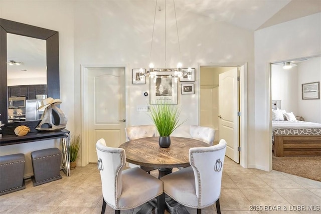 62 Knox Rd Unit 503, Rocky Mount, MO 65072 - dining area with high vaulted ceiling, a notable chandelier, and light tile patterned floors