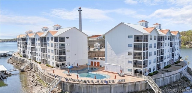 62 Knox Rd Unit 503, Rocky Mount, MO 65072 - view of property with a water view, a community pool, and fence