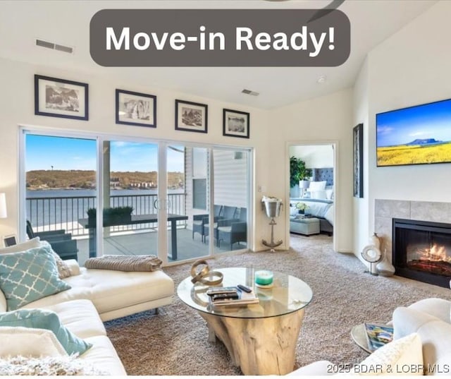 62 Knox Rd Unit 503, Rocky Mount, MO 65072 - living area with visible vents, carpet, and a tile fireplace