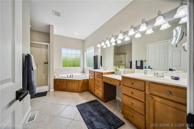 bathroom featuring visible vents, tile patterned flooring, vanity, a garden tub, and a shower stall