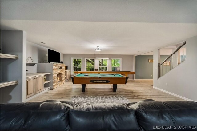 playroom featuring light wood-style floors, baseboards, and pool table